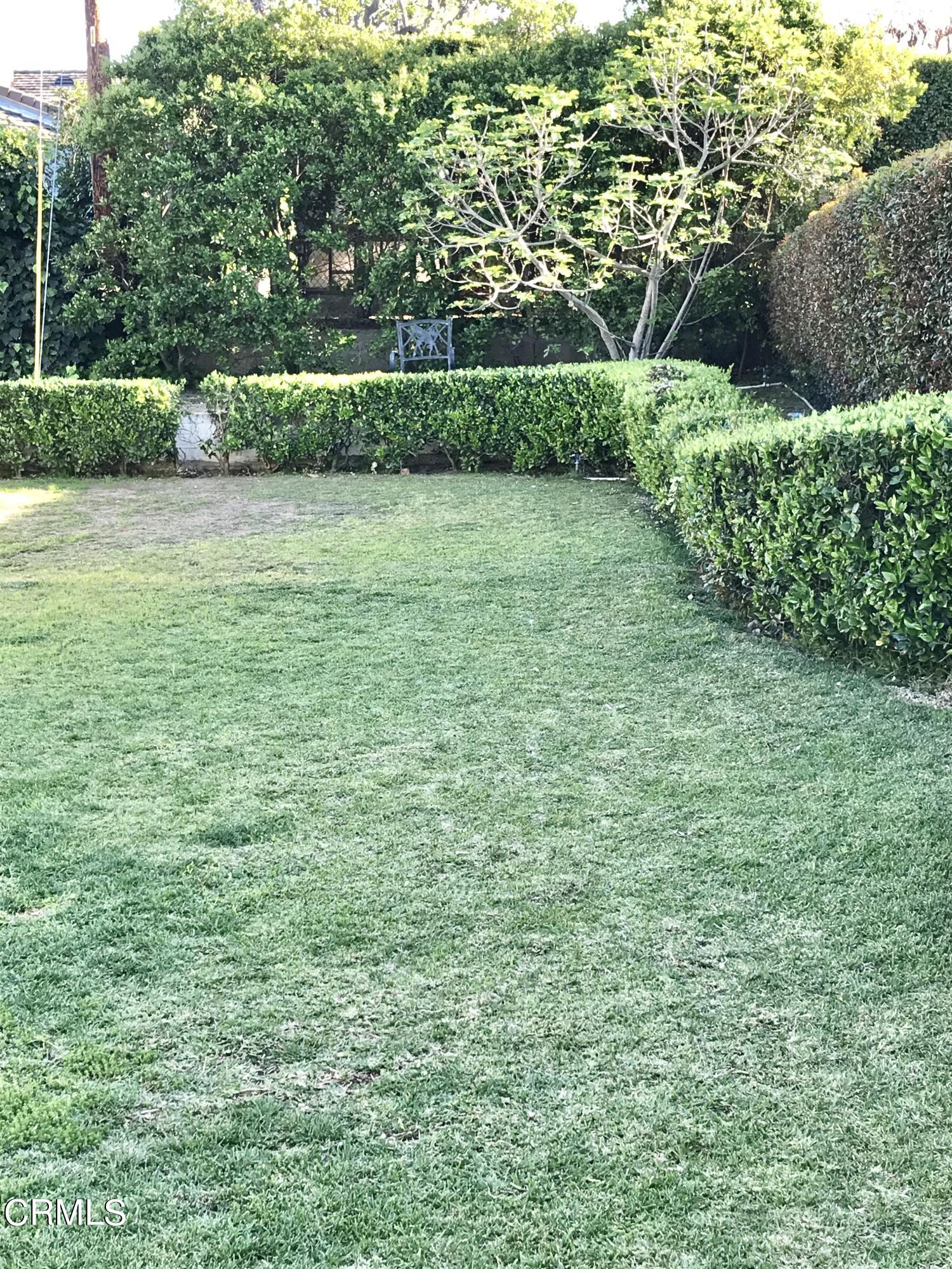 952 Balboa Drive Arcadia, CA 91007 - Photo 11 of 13 a view of a green yard with a house