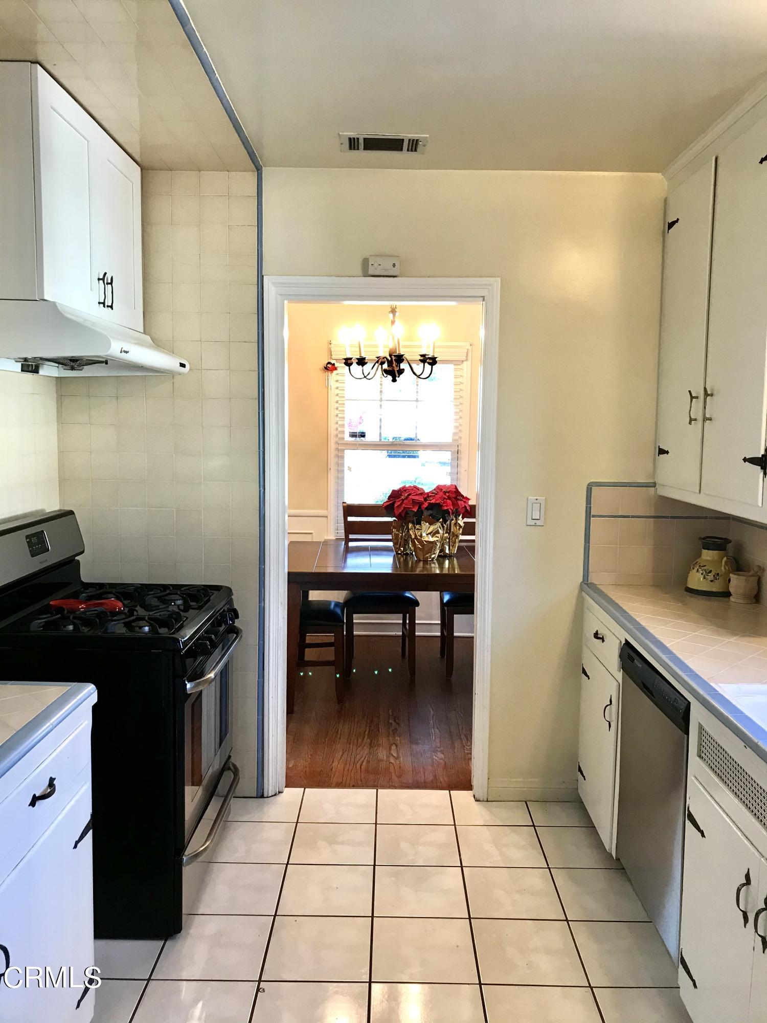 952 Balboa Drive Arcadia, CA 91007 - Photo 5 of 13 a kitchen with granite countertop a stove a sink and a refrigerator