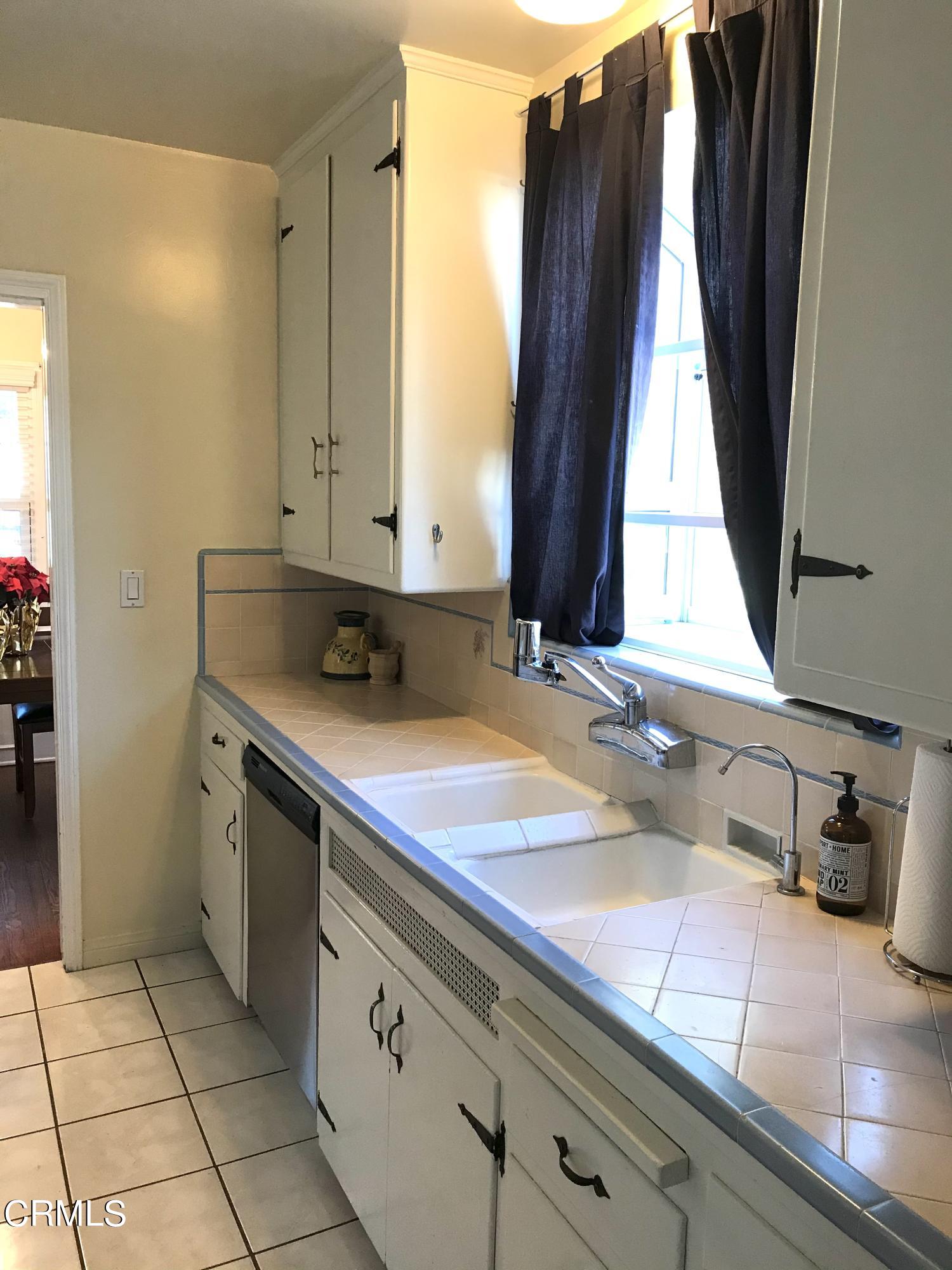 952 Balboa Drive Arcadia, CA 91007 - Photo 6 of 13 a bathroom with a sink and a mirror