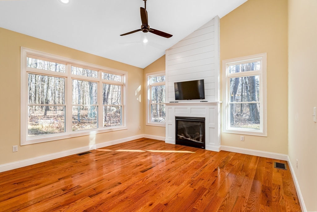 66 New Salem Road Petersham, MA 01366 - Photo 16 of 28 a view of an empty room with a fireplace and a window