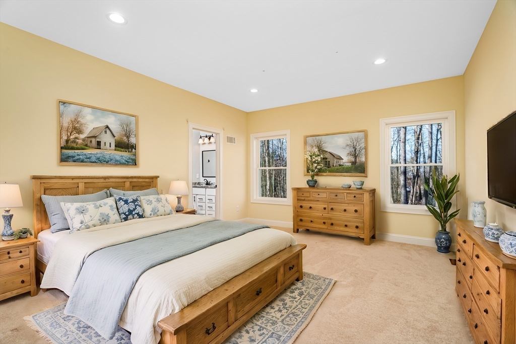 66 New Salem Road Petersham, MA 01366 - Photo 3 of 28 a bedroom with a bed and a flat screen tv