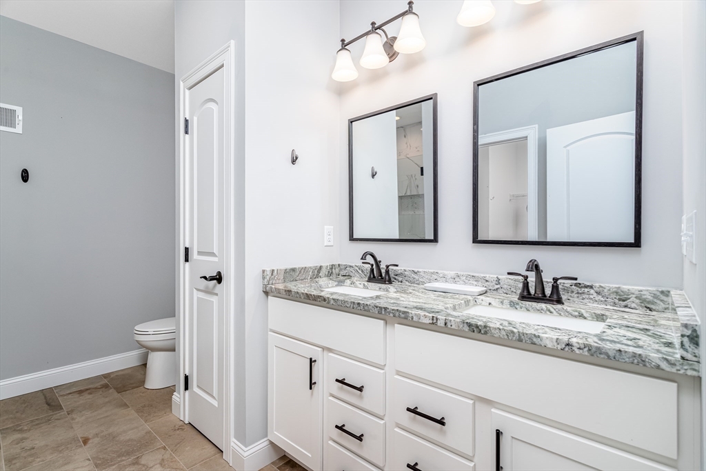 66 New Salem Road Petersham, MA 01366 - Photo 4 of 28 a bathroom with a granite countertop sink mirror and toilet