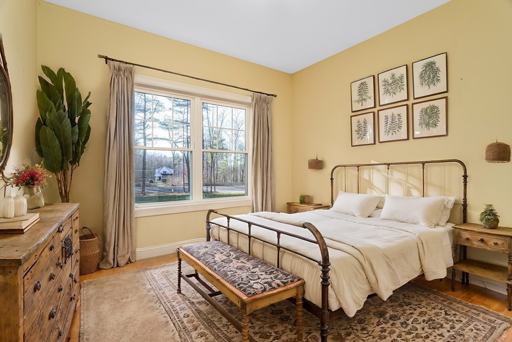 66 New Salem Road Petersham, MA 01366 - Photo 7 of 28 a bedroom with a bed and a flat screen tv