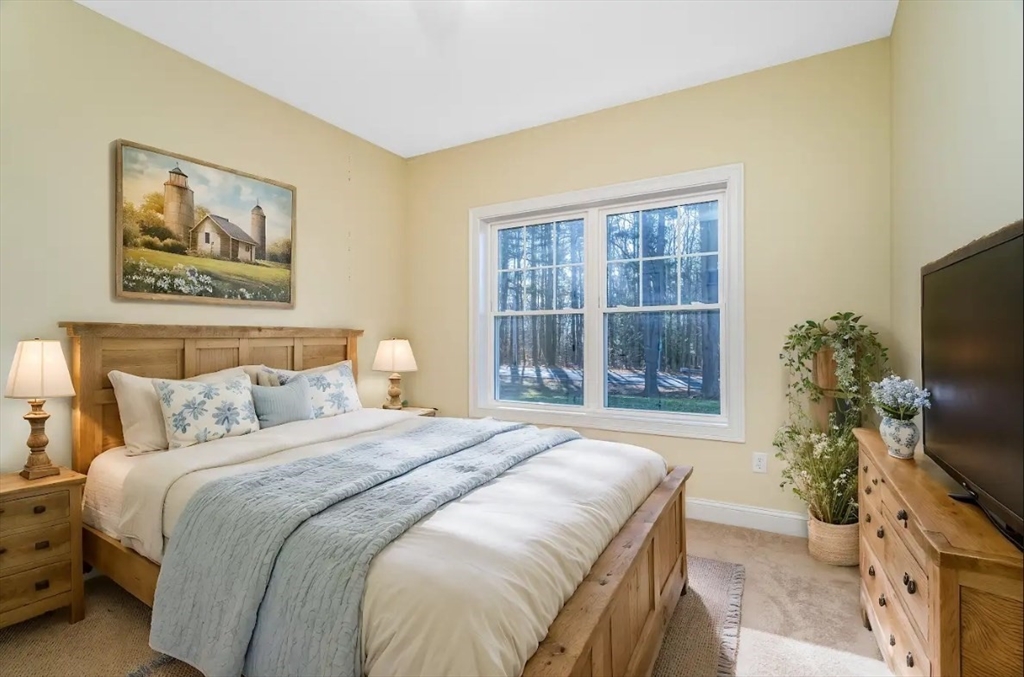 66 New Salem Road Petersham, MA 01366 - Photo 9 of 28 a bedroom with a bed and a flat screen tv