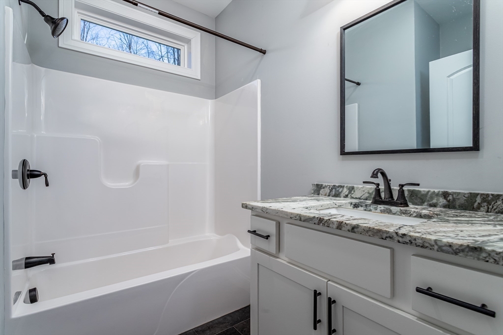 66 New Salem Road Petersham, MA 01366 - Photo 10 of 28 a bathroom with a granite countertop sink toilet and bathtub