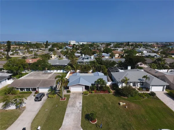 an aerial view of a houses with a lake view