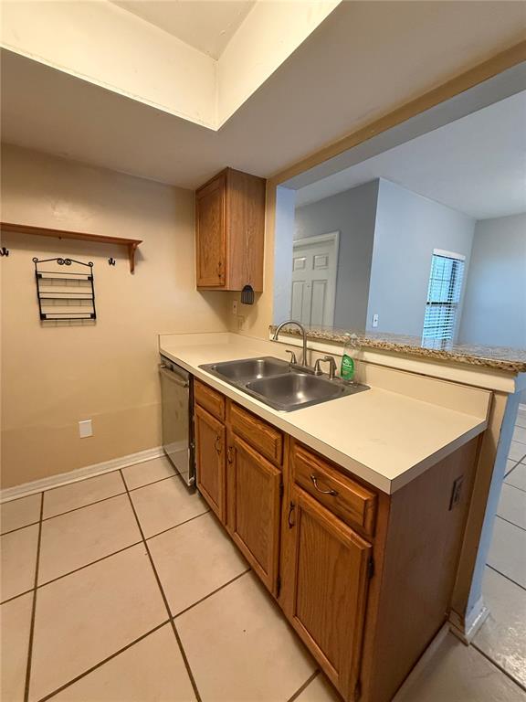 7200 Southwest 8th Avenue, Unit T128 Gainesville, FL 32607 - Photo 11 of 38 a kitchen with a sink cabinets and window