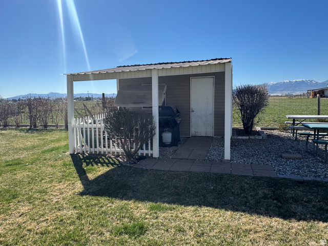 655 North 8th East Preston, ID 83263 - Photo 29 of 32 View of shed featuring a mountain view and a view of countryside