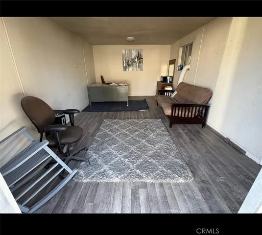 a view of a workspace with furniture