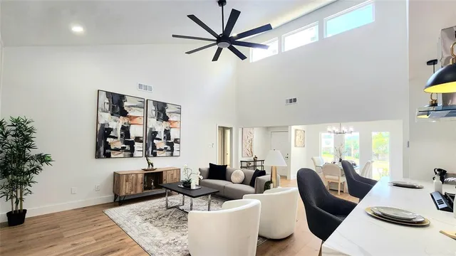 a living room with furniture and wooden floor