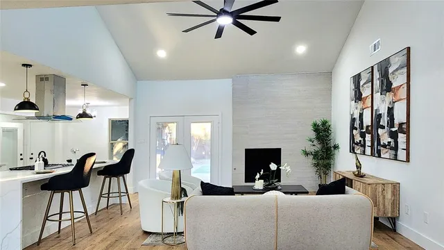 a living room with furniture and a fireplace