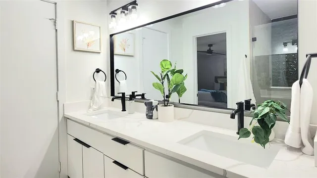 a bathroom with sink and a mirror