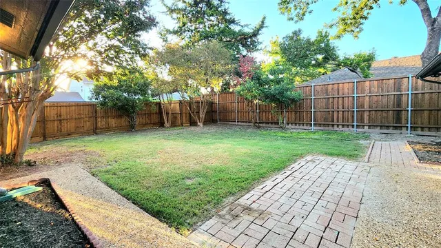 a view of a backyard with a garden