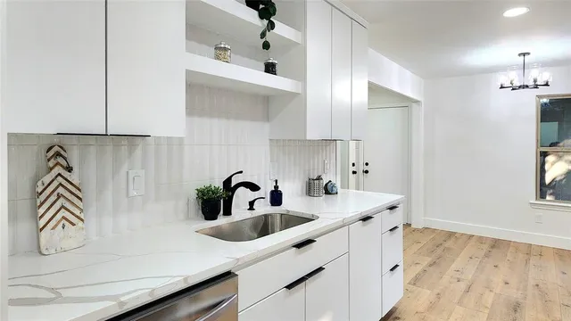 a kitchen with a sink and a refrigerator