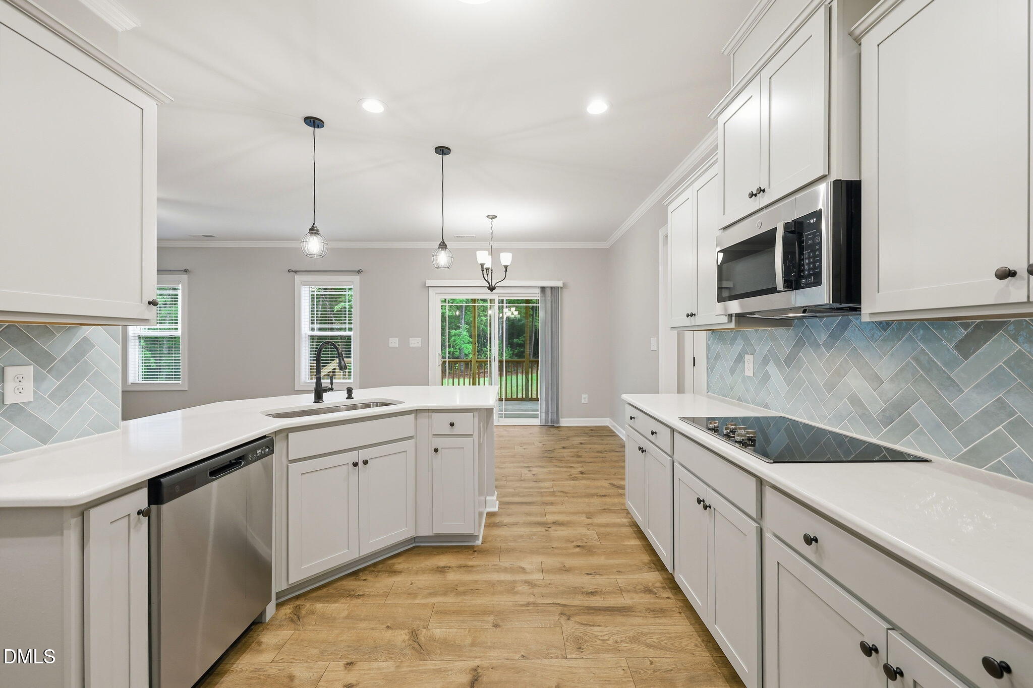 146 Seahawk Way Zebulon, NC 27597 - Photo 17 of 51 a kitchen with stainless steel appliances granite countertop a sink and stove top oven