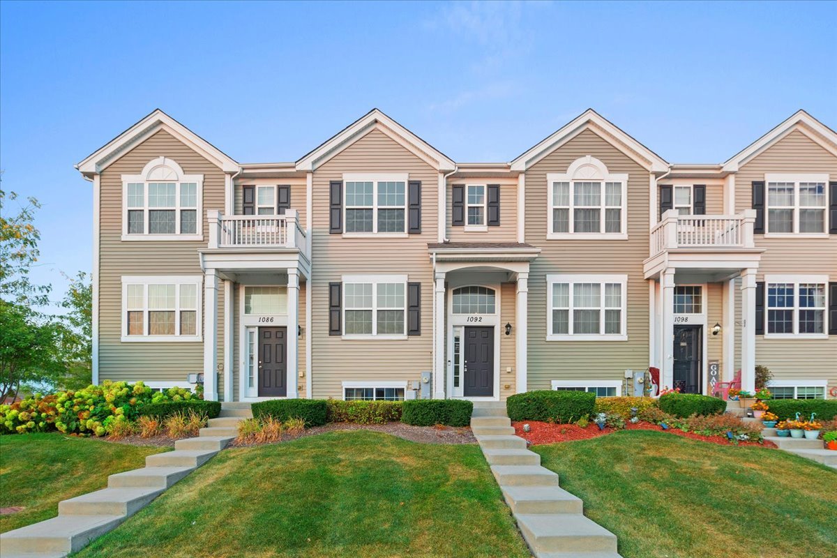 1092 Sapphire Lane Pingree Grove, IL 60140 - Photo 1 of 21 a front view of a house with a yard