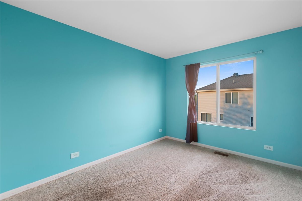 1092 Sapphire Lane Pingree Grove, IL 60140 - Photo 12 of 21 a view of an empty room with a window