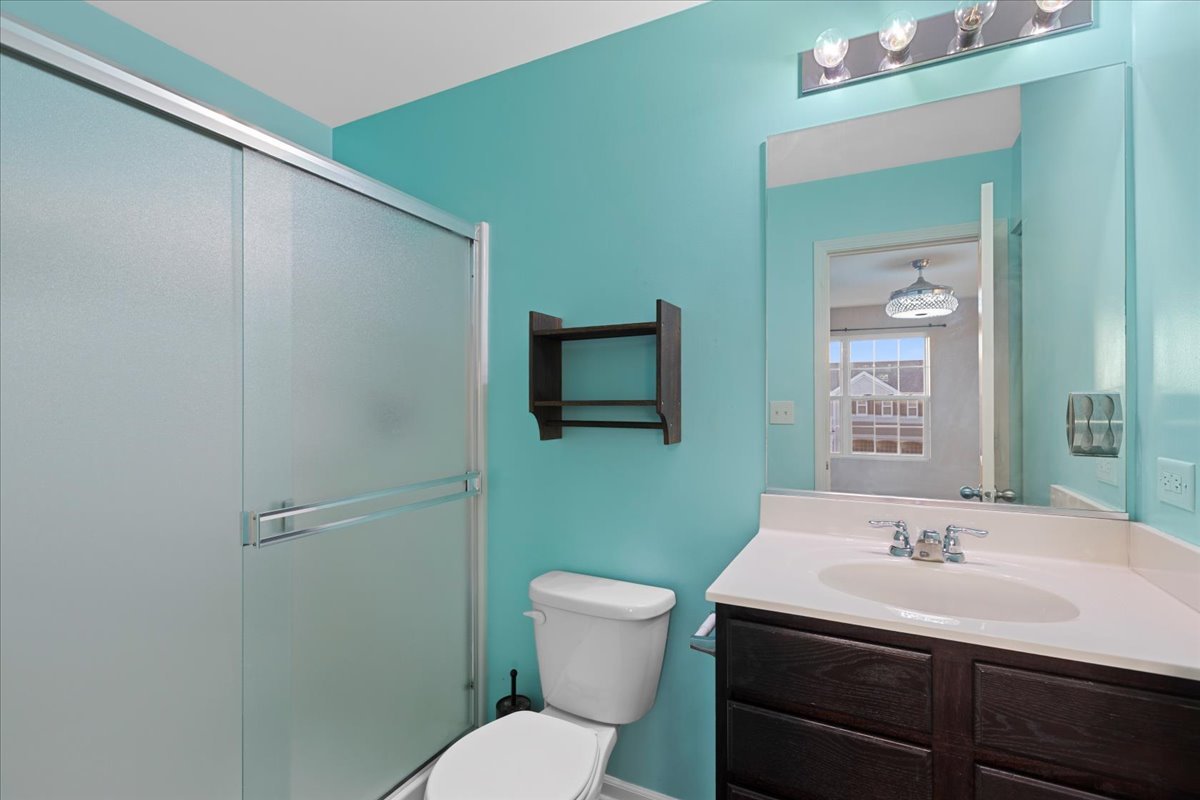1092 Sapphire Lane Pingree Grove, IL 60140 - Photo 16 of 21 a bathroom with a sink toilet and mirror