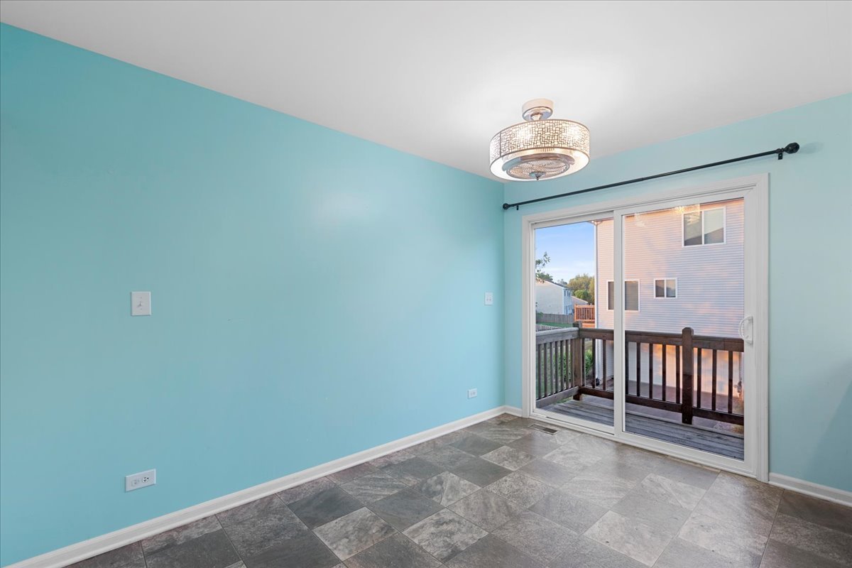 1092 Sapphire Lane Pingree Grove, IL 60140 - Photo 4 of 21 an empty room with wooden floor and windows