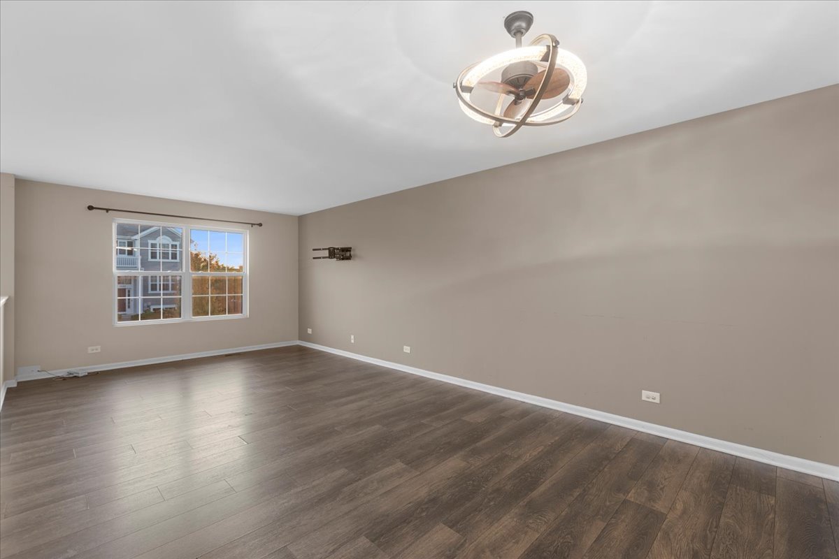 1092 Sapphire Lane Pingree Grove, IL 60140 - Photo 9 of 21 an empty room with wooden floor and windows