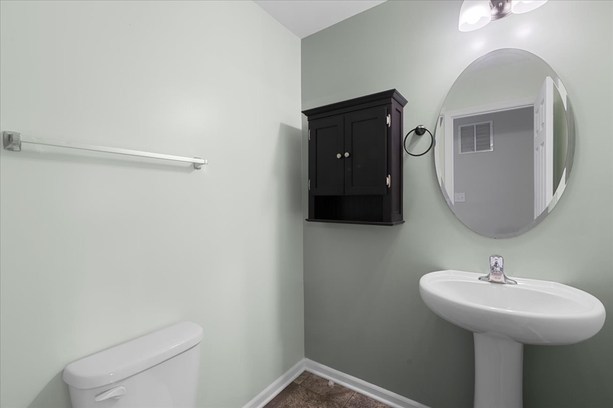 1092 Sapphire Lane Pingree Grove, IL 60140 - Photo 10 of 21 a bathroom with a sink toilet and mirror