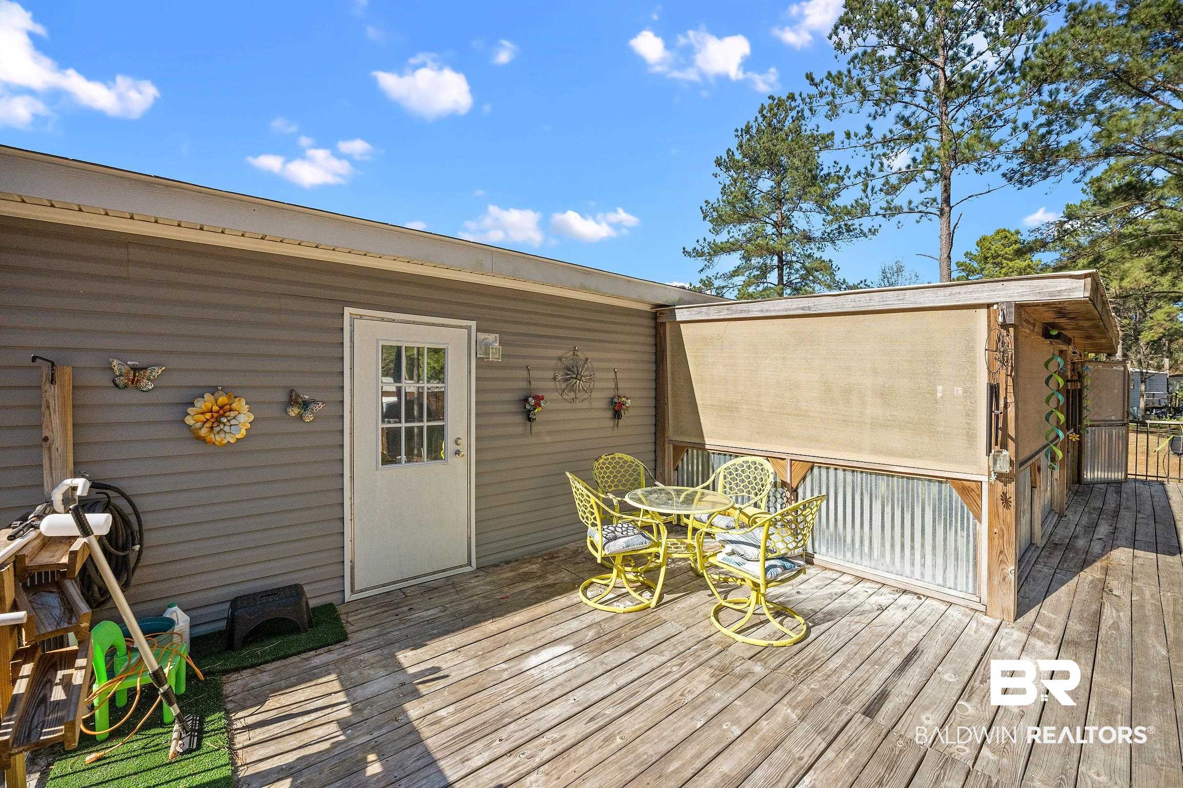 8630 Allison Lane Wilmer, AL 36587 - Photo 28 of 31 Wooden deck with outdoor dining area