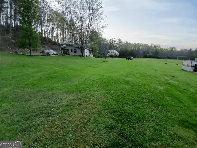 a view of a fountain in front of the house