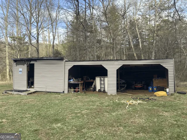 a view of a backyard with swimming pool