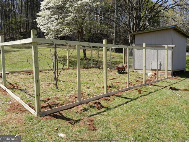 a view of a garden in a backyard