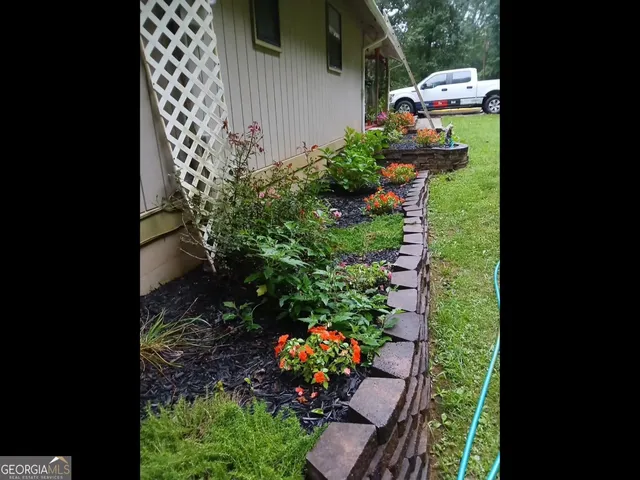 a kitchen with stainless steel appliances granite countertop a refrigerator and a stove
