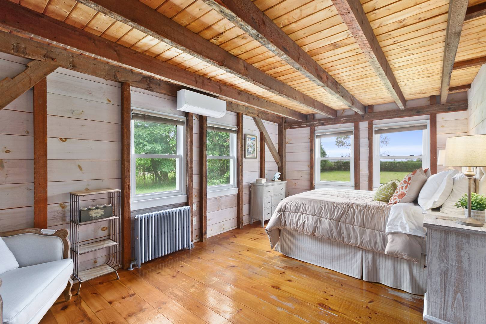 7 Town Line Road Wainscott, NY 11975 - Photo 12 of 17 a bedroom with a large bed and a couch