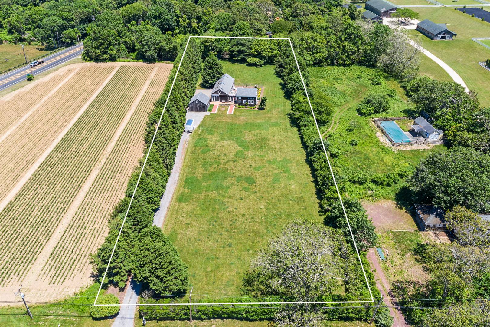 7 Town Line Road Wainscott, NY 11975 - Photo 4 of 17 an aerial view of residential houses with outdoor space