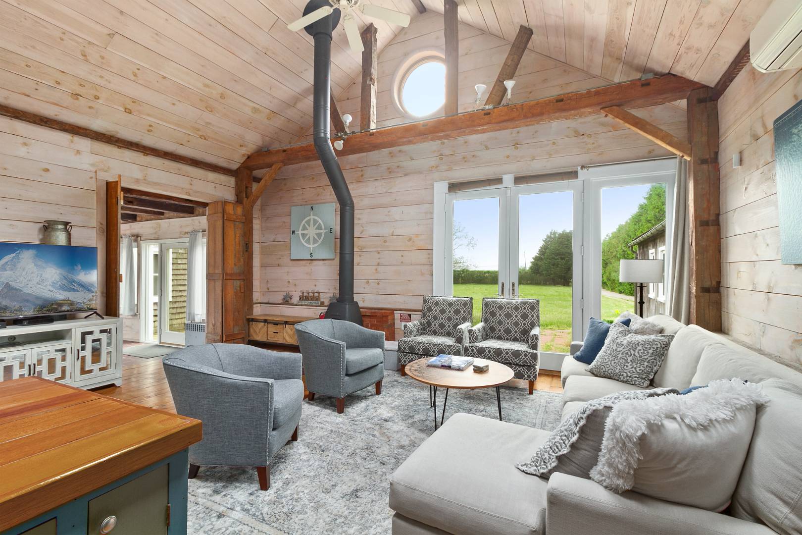 7 Town Line Road Wainscott, NY 11975 - Photo 10 of 17 a living room with furniture and a flat screen tv