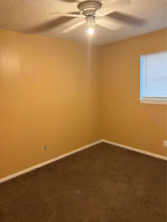 a bathroom with a sink a toilet and a shower