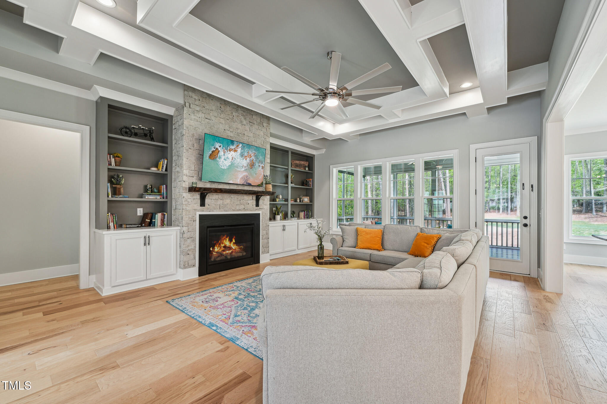 3545 Donlin Drive Wake Forest, NC 27587 - Photo 12 of 62 a living room with furniture a fireplace and a flat screen tv