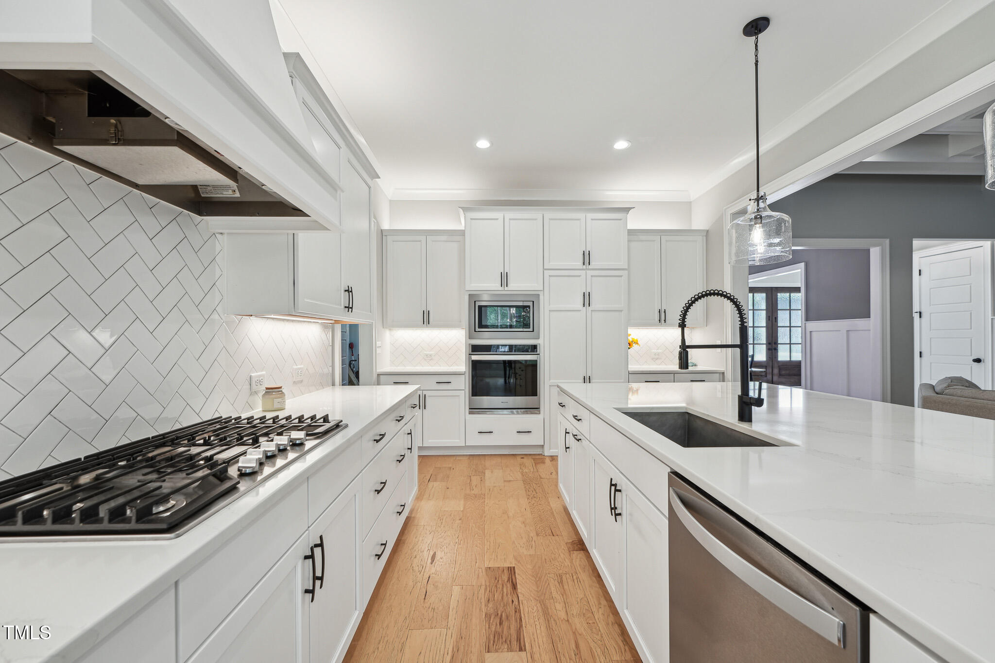 3545 Donlin Drive Wake Forest, NC 27587 - Photo 18 of 62 a kitchen with stove a sink and cabinets
