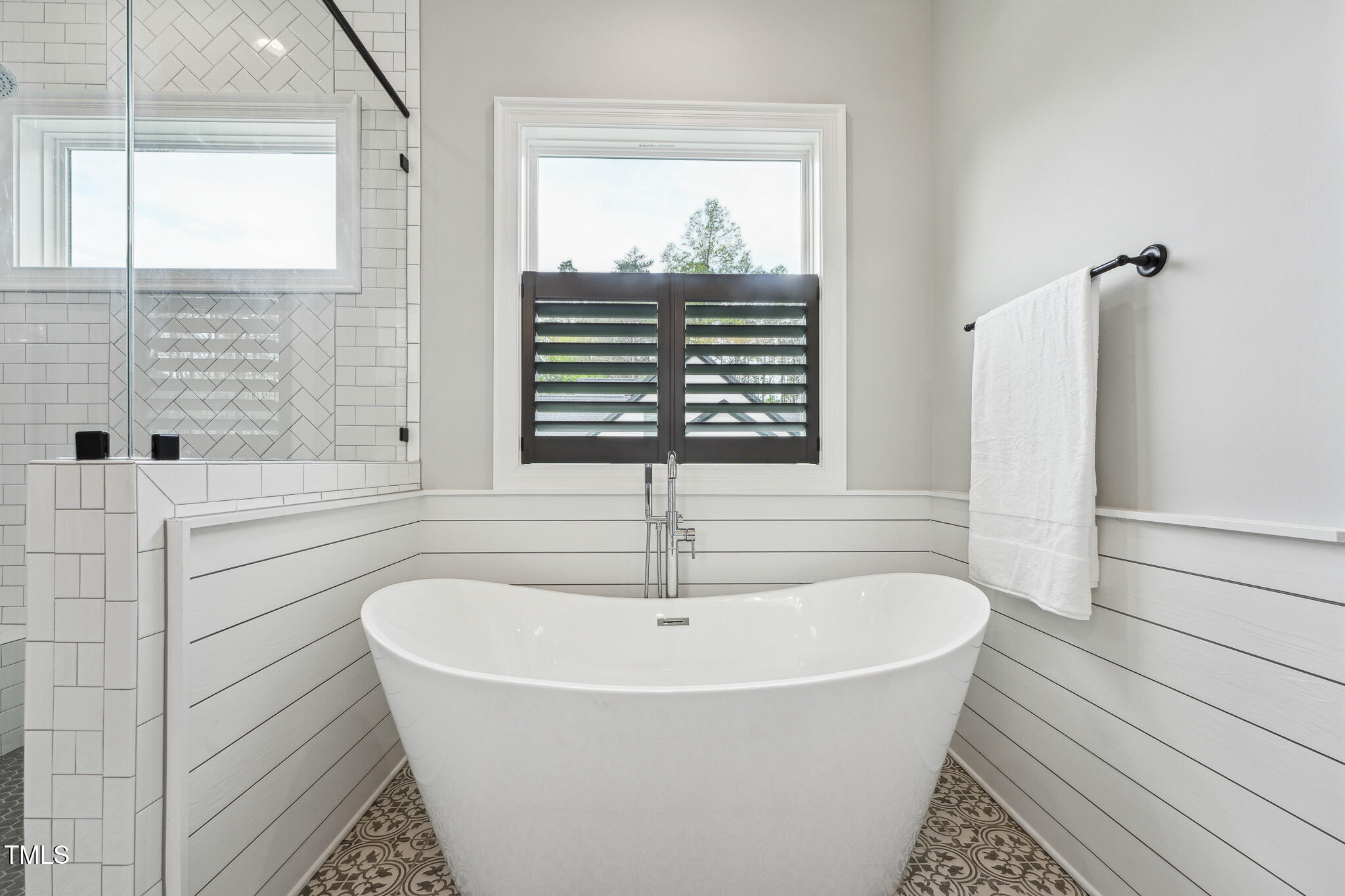 3545 Donlin Drive Wake Forest, NC 27587 - Photo 32 of 62 a bathroom with bathtub and window