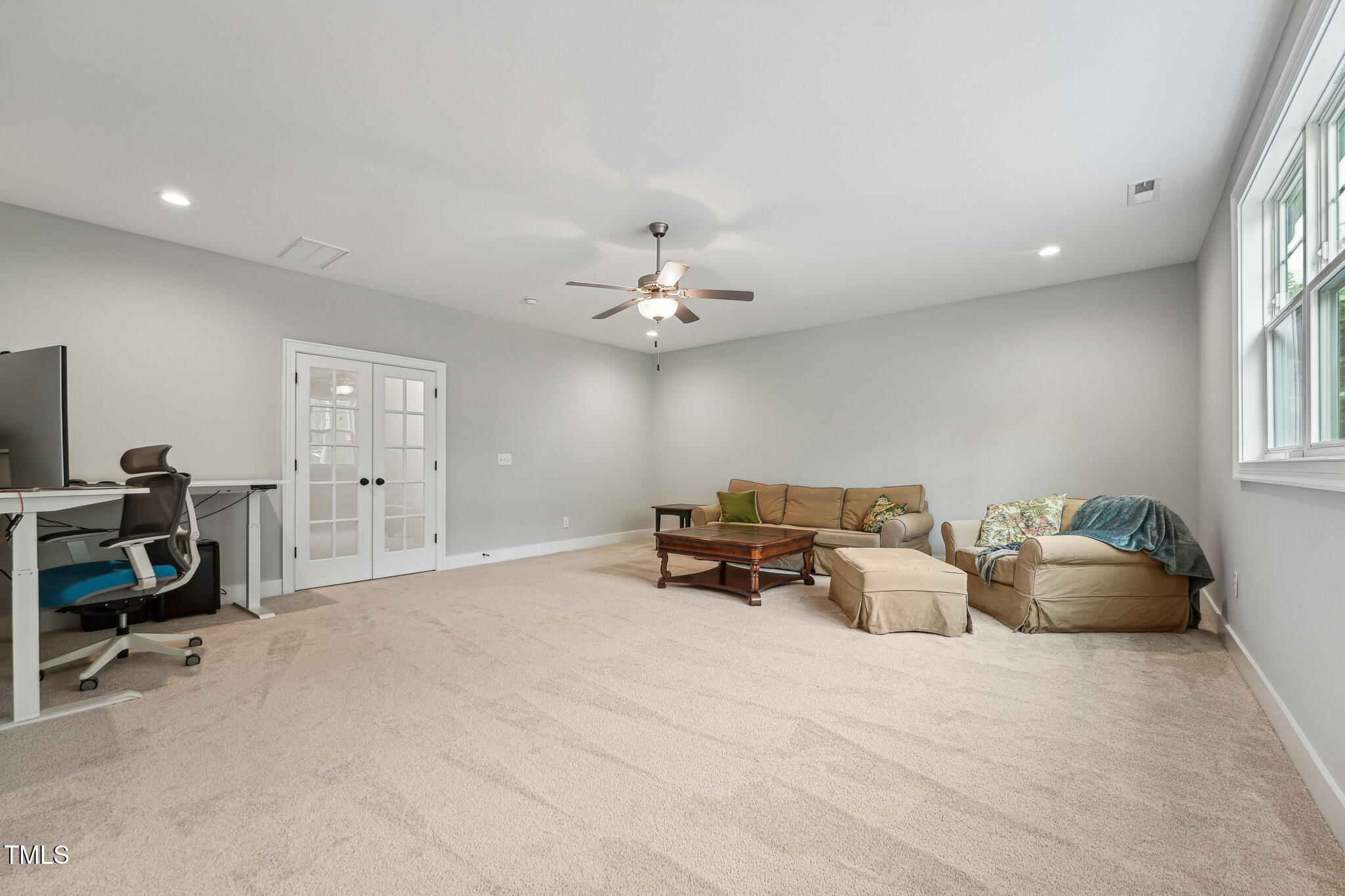 3545 Donlin Drive Wake Forest, NC 27587 - Photo 41 of 62 a living room with furniture and a flat screen tv