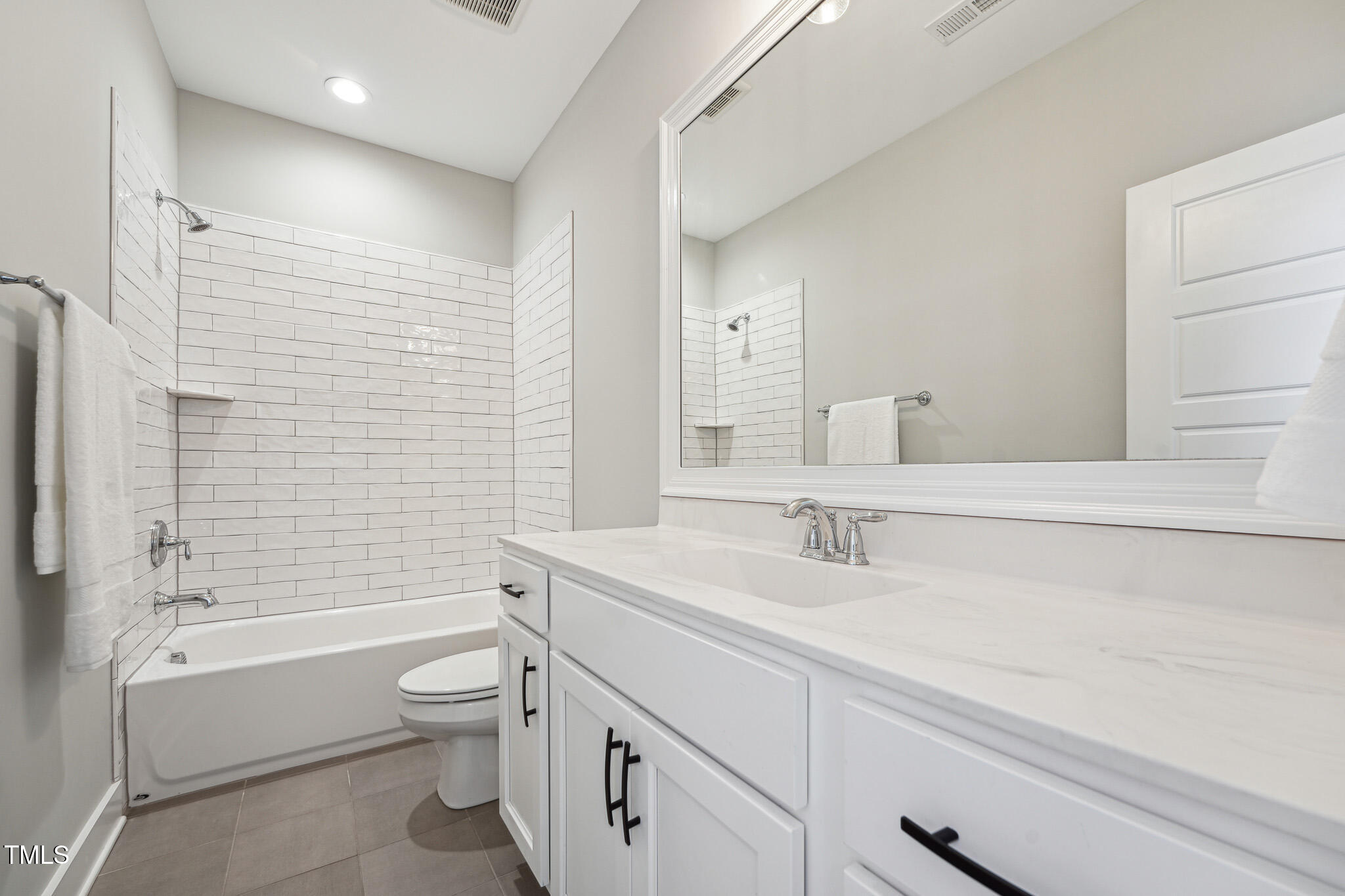 3545 Donlin Drive Wake Forest, NC 27587 - Photo 45 of 62 a bathroom with a bathtub shower sink vanity mirror and toilet