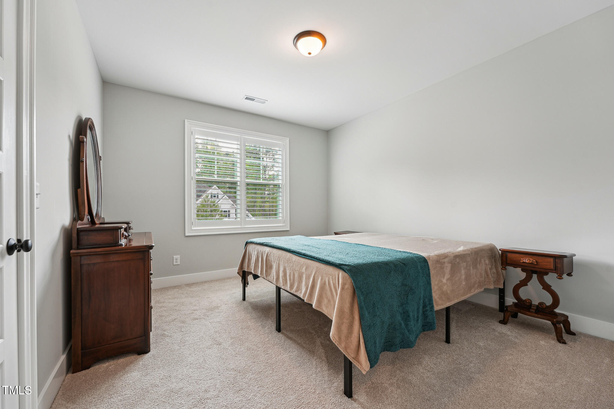 3545 Donlin Drive Wake Forest, NC 27587 - Photo 46 of 62 a bedroom with a bed and a window
