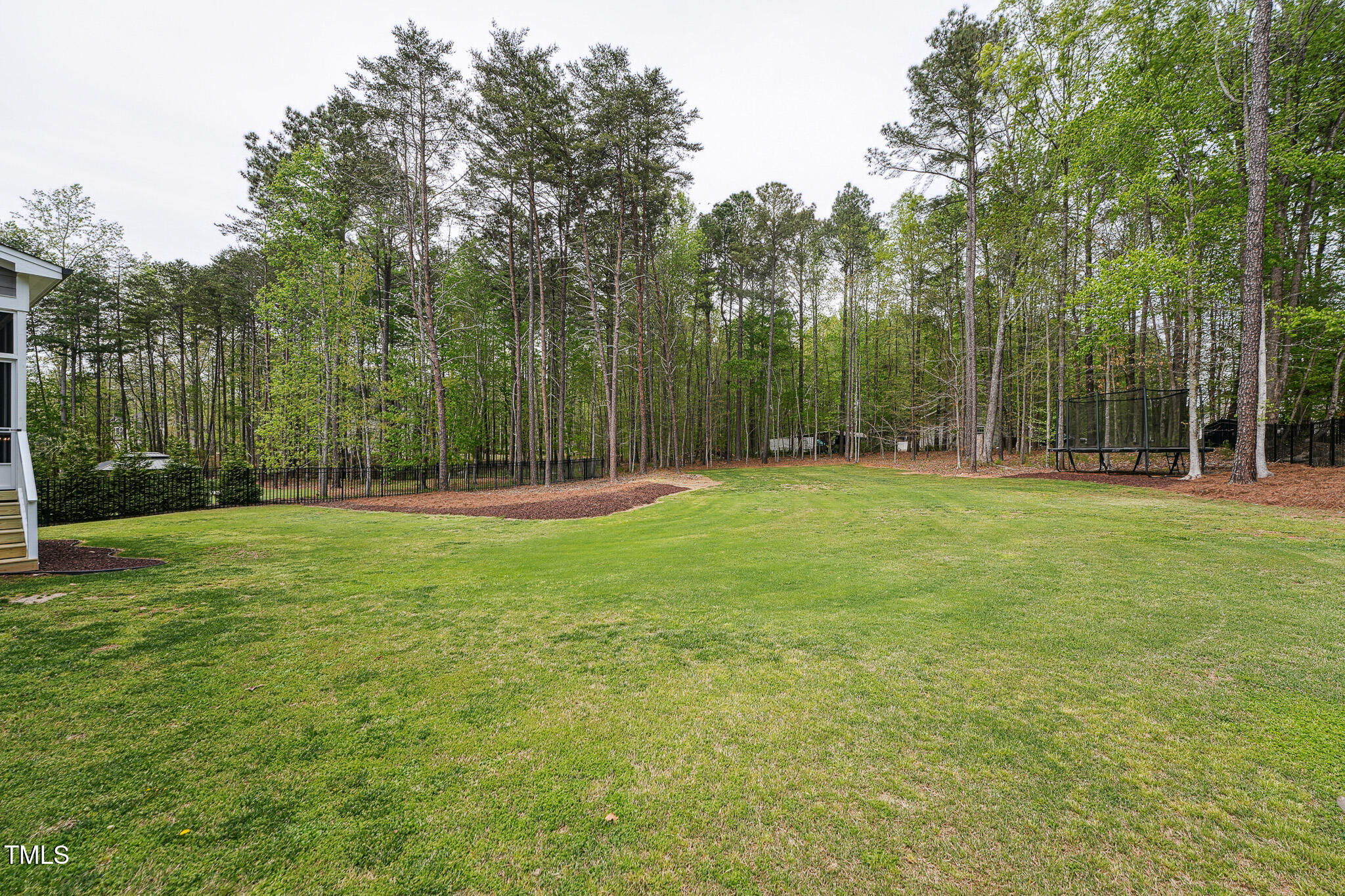 3545 Donlin Drive Wake Forest, NC 27587 - Photo 55 of 62 a backyard of a house with lots of green space