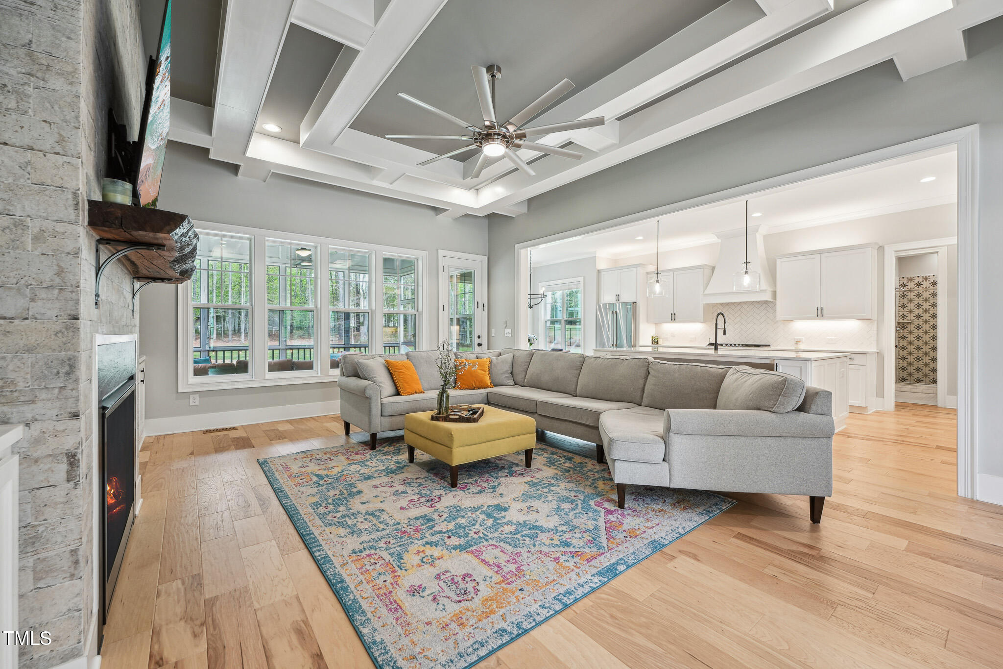 3545 Donlin Drive Wake Forest, NC 27587 - Photo 8 of 62 a living room with furniture a fireplace and a floor to ceiling window