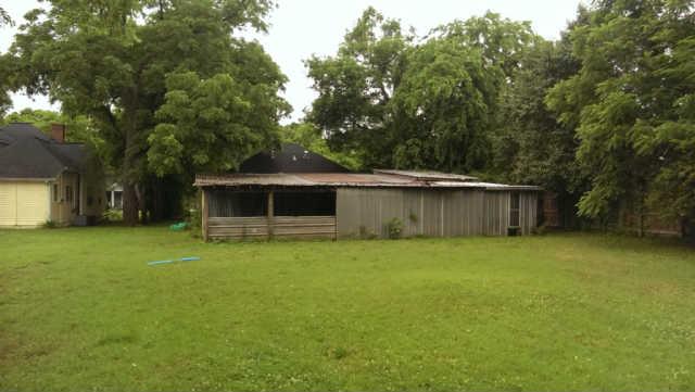 235 West Spring Street Lebanon, TN 37087 - Photo 19 of 20 Even with the barn, the back yard is very deep. This picture looks back at the barn and house (and you can see the NEW ROOF!)