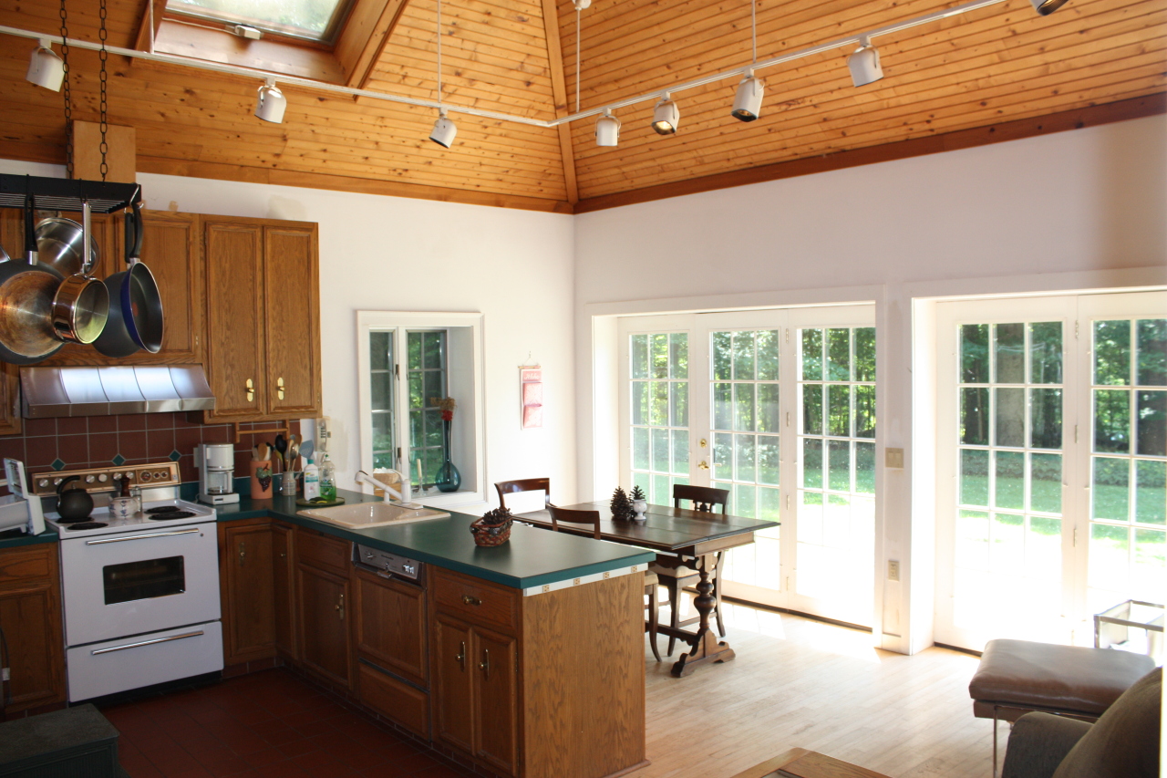 476 Main Road Monterey, MA 01245 - Photo 5 of 18 a view of a kitchen with stainless steel appliances granite countertop a stove and a refrigerator