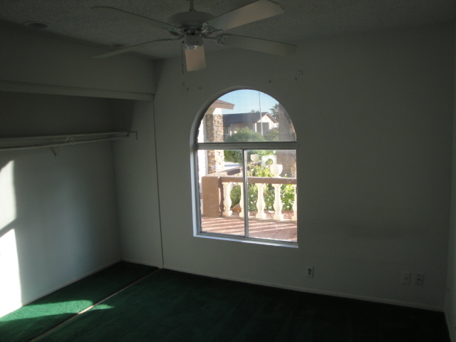7430 West Hatcher Road Peoria, AZ 85345 - Photo 5 of 9 an empty room with a window