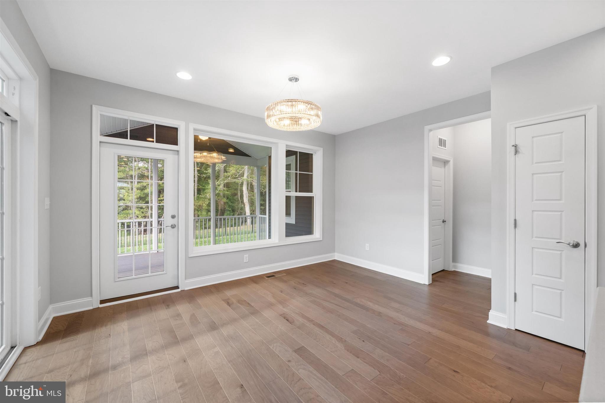22144 Welches Way Lewes, DE 19958 - Photo 24 of 77 a view of an empty room with wooden floor and a window