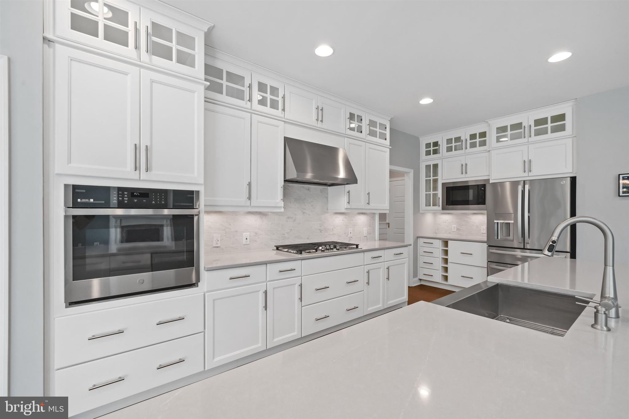 22144 Welches Way Lewes, DE 19958 - Photo 25 of 77 a kitchen with stainless steel appliances a stove microwave and sink