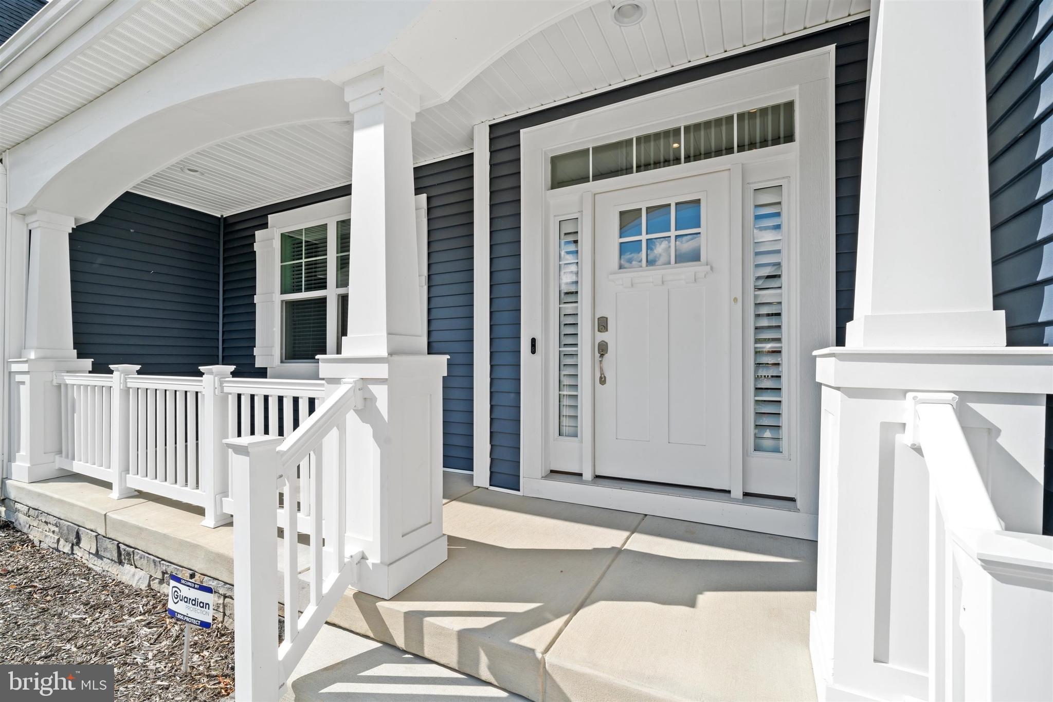 22144 Welches Way Lewes, DE 19958 - Photo 3 of 77 front view of a house with a porch