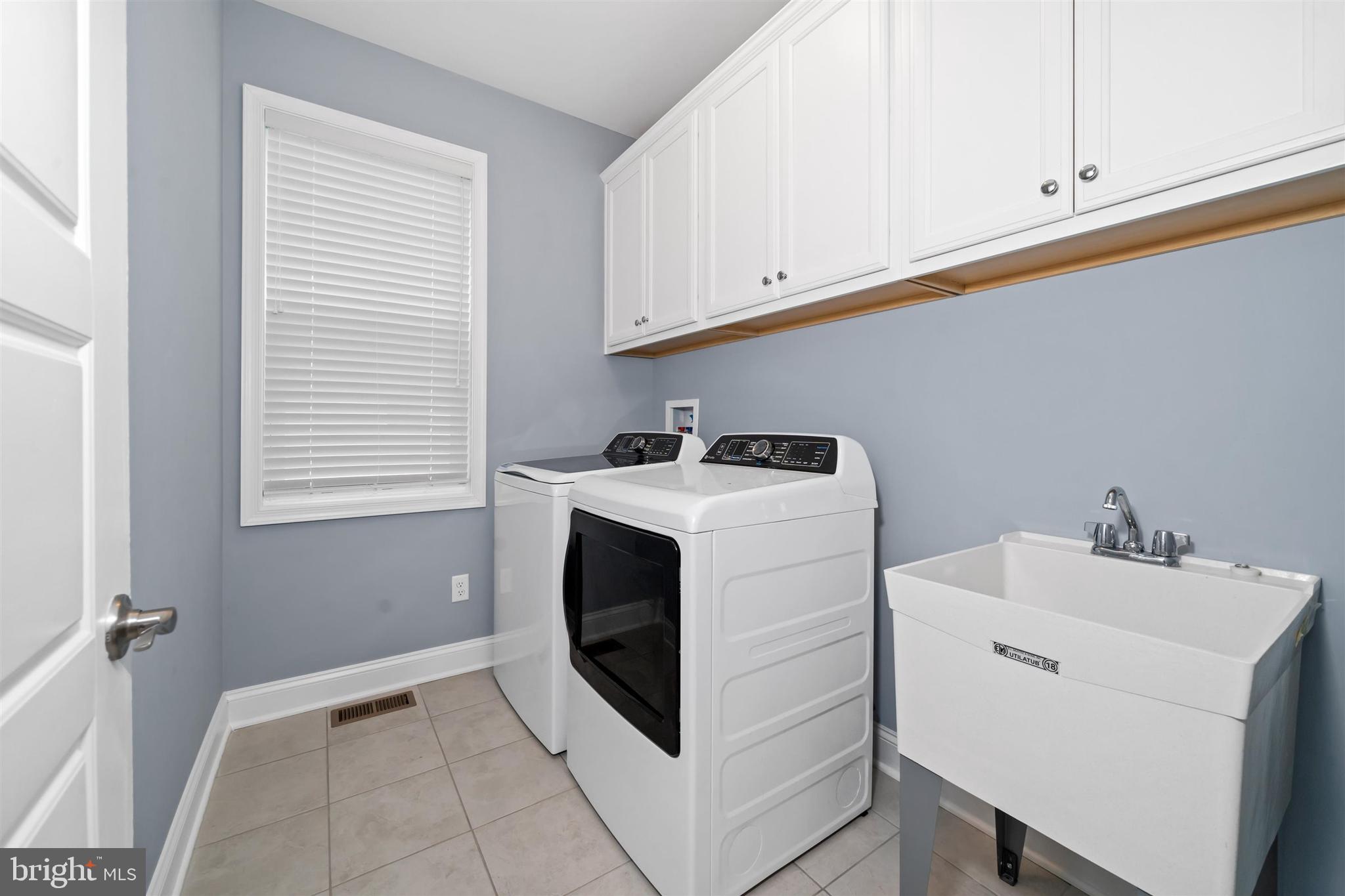 22144 Welches Way Lewes, DE 19958 - Photo 43 of 77 a utility room with dryer and washer