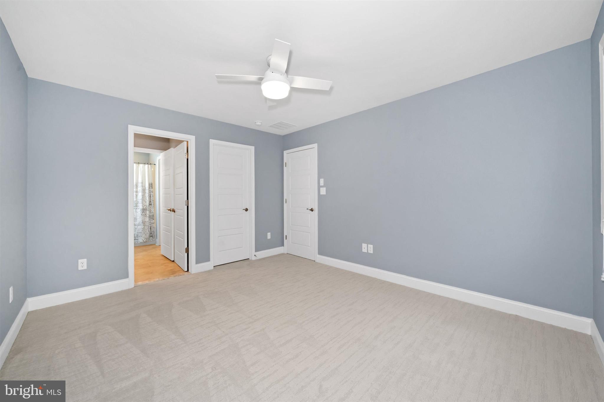22144 Welches Way Lewes, DE 19958 - Photo 49 of 77 a view of an empty room with a chandelier fan